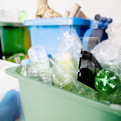 Used plastic bottles in recycling bins for earth day campaign